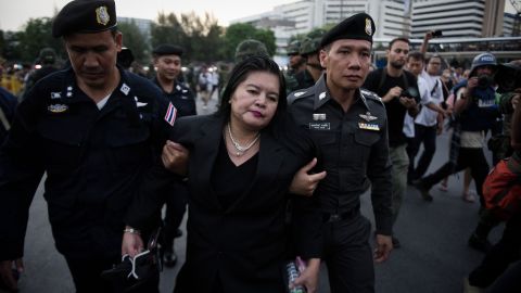 Thai police take a woman away from an anti-coup protest in Bangkok on May 26.