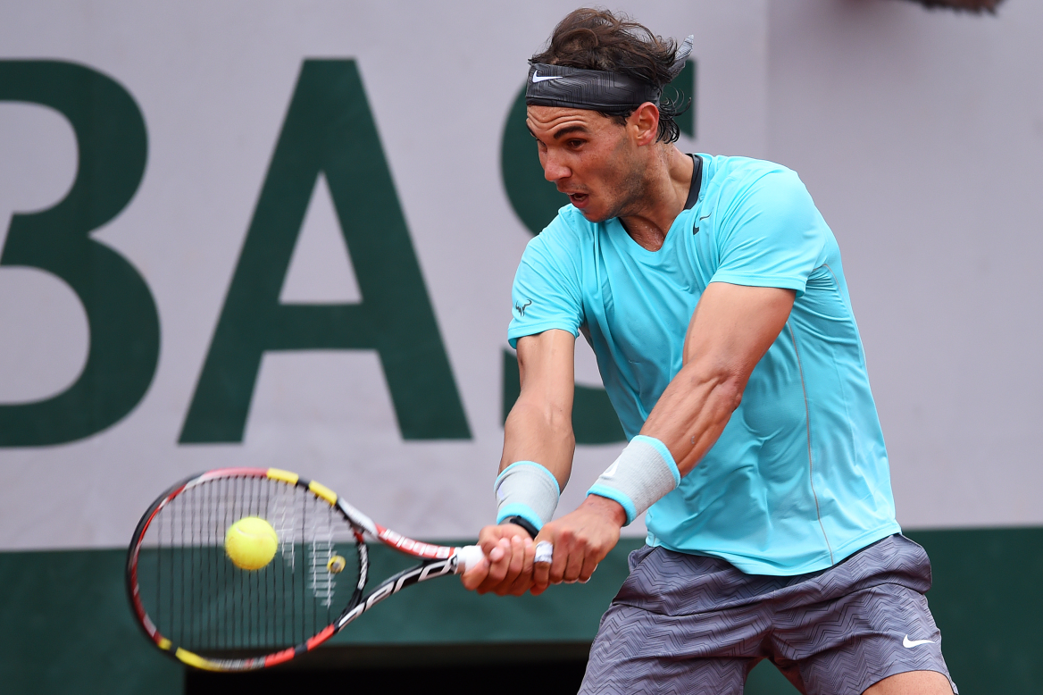 Rafael Nadal bludgeons another return during his straight sets win over Robby Ginepri in Paris.
