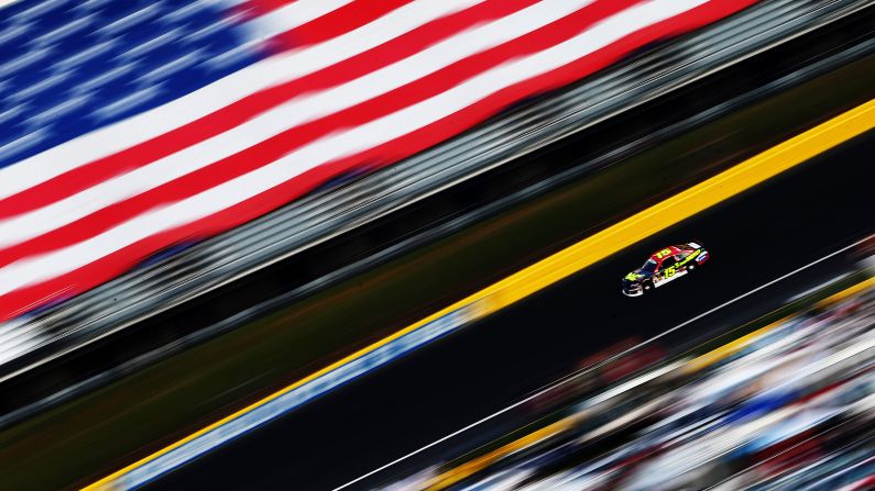 Using a panning motion and a slow shutter speed, a photographer captured this shot of NASCAR driver Clint Bowyer during the Coca-Cola 600 on Sunday, May 25, at Charlotte Motor Speedway in Concord, North Carolina. Jimmie Johnson won the race, which traditionally takes place on Memorial Day weekend.