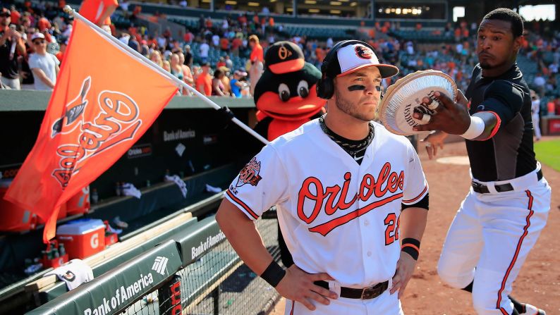 Adam Jones of the Baltimore Orioles prepares to hit teammate Steve Pearce with a pie after the Orioles' 4-2 win over the Cleveland Indians on Sunday, May 25, in Baltimore. A pie in the face has become a celebratory tradition after Orioles home victories, with the target often being the game's star player as he is interviewed on television. Pearce went 3-for-4 in Sunday's game.