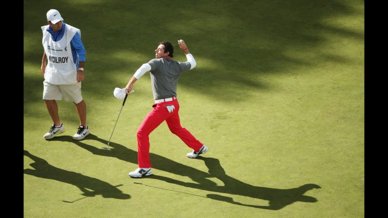 Rory McIlroy throws a golf ball to the crowd after winning the BMW PGA Championship, the European Tour's flagship event, in Virginia Water, England, on Sunday, May 25. It was McIlroy's first tournament win this year, and it came just days after he announced his breakup with tennis star Caroline Wozniacki.