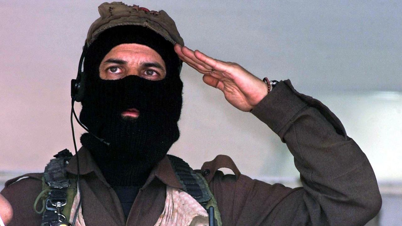 Subcommander Marcos, rebel leader of the Zapatista National Liberation Army (EZLN), sings the EZLN anthem at the closing of a rally in the Metropolitan Autonomous University of Azcapotzalco in Mexico City, Mexico, on March 20, 2001. Subcomandante Marcos, the mysterious masked leader of Mexico's Zapatista rebels, said on May 25, 2014, that he was stepping aside as chief of the 20-year-old movement.