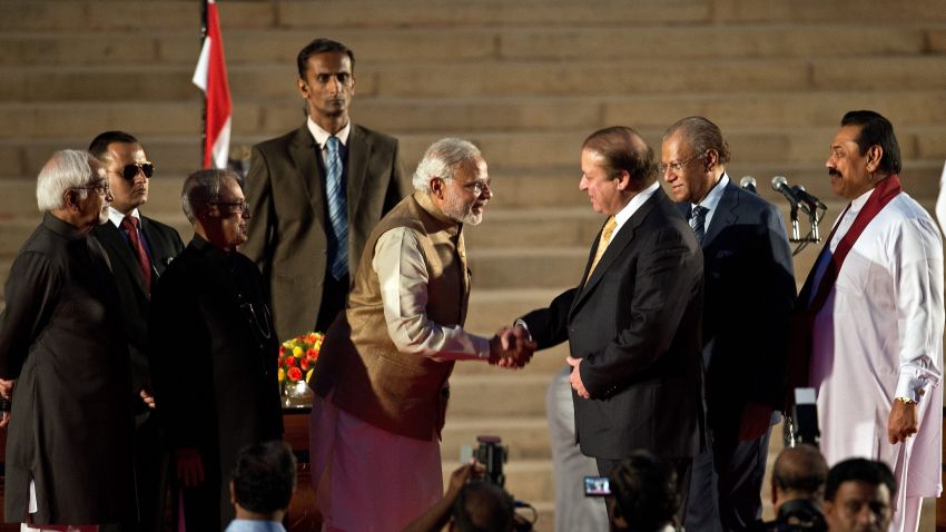 Newly sworn-in Indian Prime Minister Narendra Modi (5th L) shakes hands with Pakistani Prime Minister Nawaz Sharif (3rd R) as Sri Lankan President Mahinda Rajapakse (R) looks on after the swearing-in ceremony at the Presidential Palace in New Delhi on May 26, 2014. India's Narendra Modi was sworn in as prime minister May 26 with the strongest mandate of any leader for 30 years, promising to forge a 'strong and inclusive' country on a first day that signalled his bold intentions. AFP PHOTO/Prakash SINGH (Photo credit should read PRAKASH SINGH/AFP/Getty Images)