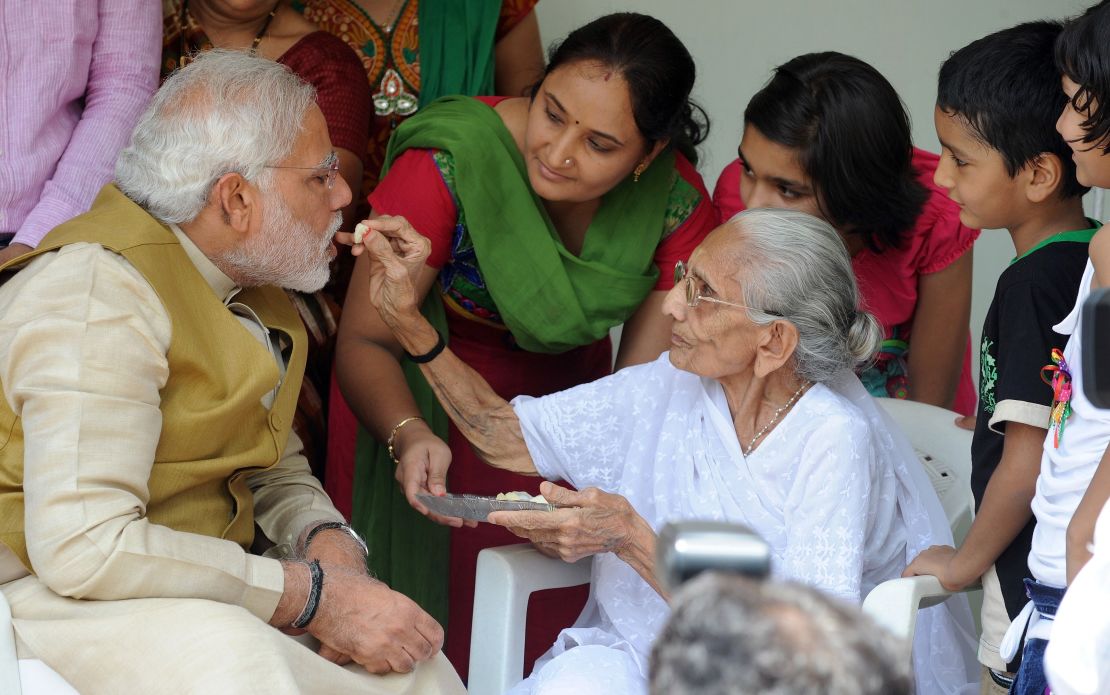 The image said to have moved Sharif's mother: Modi's mother feeding him sweets on May 16, 2014.