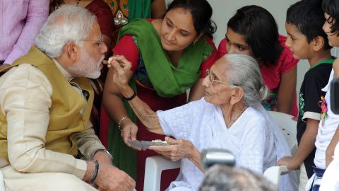 The image said to have moved Sharif's mother: Modi's mother feeding him sweets on May 16, 2014.