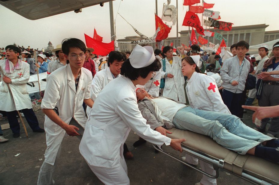 May 17, 1989: Five days in and the hunger strike begins to take its toll on students. Paramedics evacuate ailing protestors from the square. 