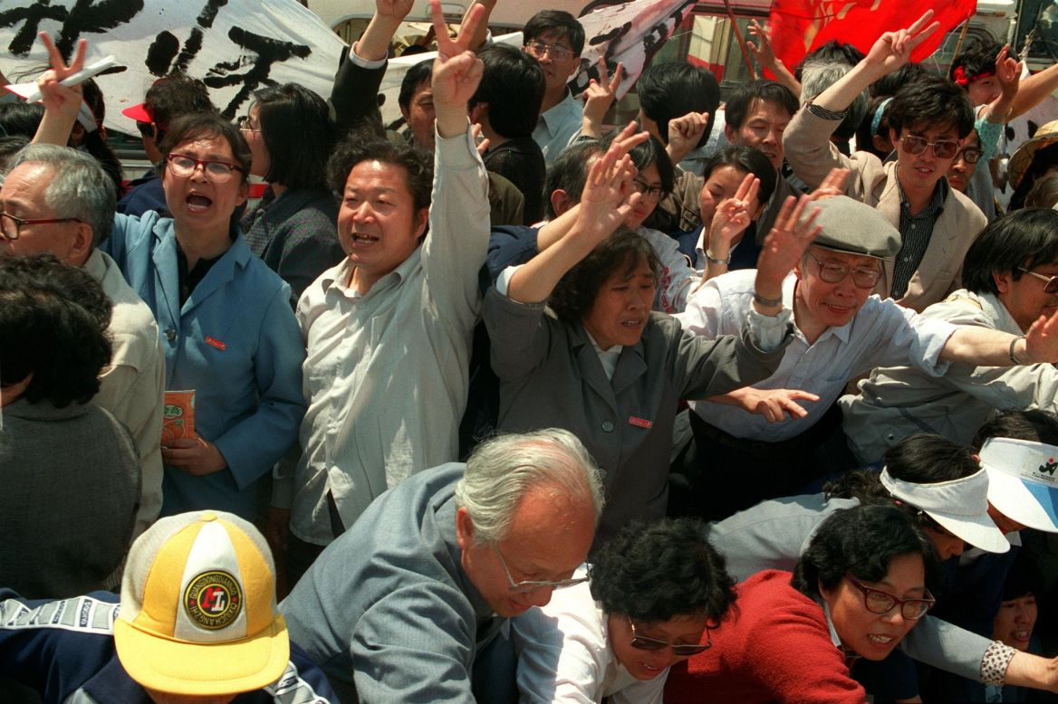 May 20, 1989, teachers from Beijing Normal University arrive at Tiananmen Square by the truckload to support their students after martial law was declared.