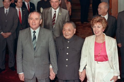 May 16, 1989, then Chinese President Deng Xiaoping (center) takes then Soviet President Mikhail Gorbachev and his wife Raisa by the hand at the Great Hall of the People. Gorbachev's visit coincided with the student hunger strikes, forcing the official reception to be moved from Tiananmen Square to the airport -- embarrassing for the Chinese leadership.