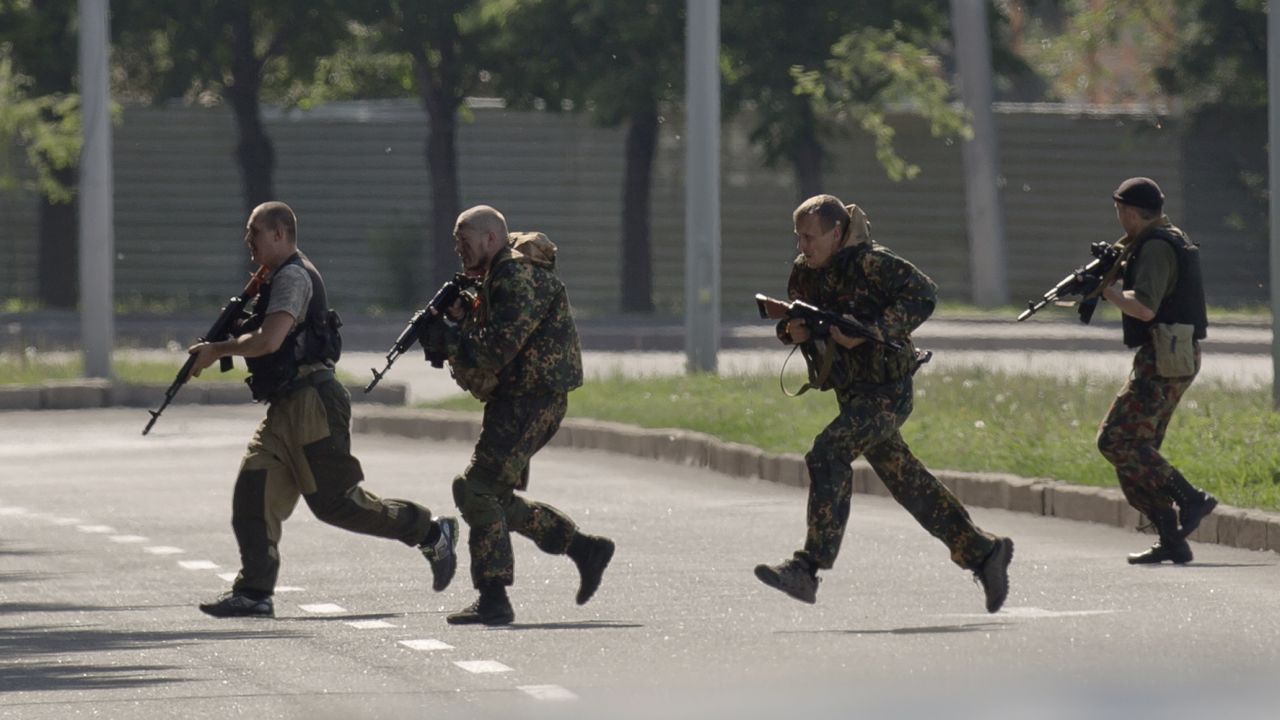 Pro-Russian gunmen take positions near the airport on May 26.