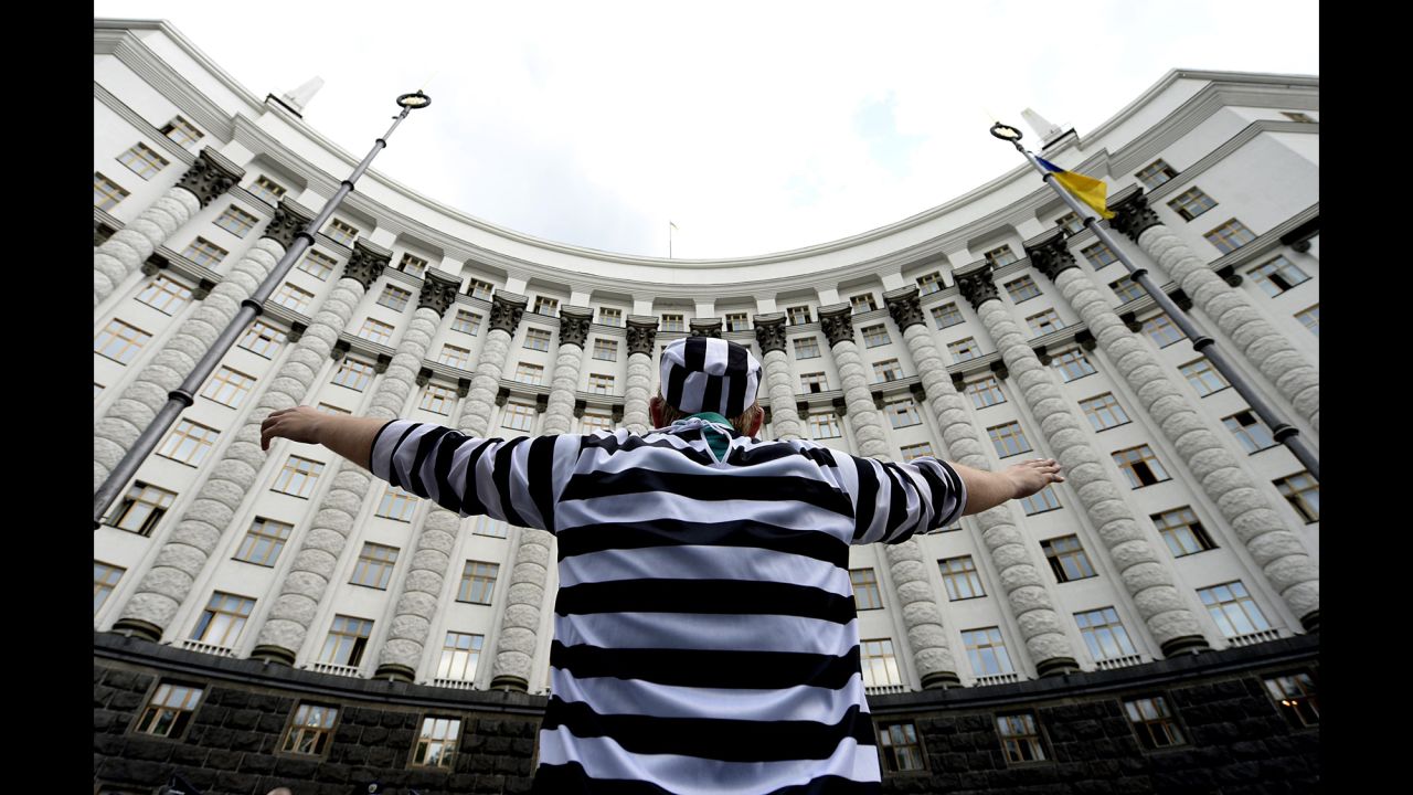 A man dressed in a prisoner costume takes part in a protest against government corruption May 27 in Kiev.