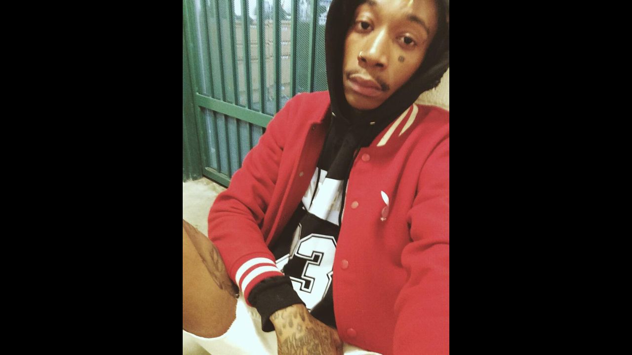 Rapper Wiz Khalifa tweeted this <a href="https://twitter.com/wizkhalifa/status/470541572094705665/photo/1" target="_blank" target="_blank">"jail selfie"</a> on Sunday, May 25. <a href="http://www.tmz.com/2014/05/25/wiz-khalifa-arrested-weed-airport-marijuana-texas/" target="_blank" target="_blank">According to TMZ,</a> he was arrested at a Texas airport after a "green leafy substance" was found during a security check. <a href="http://www.mtv.com/news/1831879/wiz-khalifa-jail-free-weed-texas-freetrapwiz/" target="_blank" target="_blank">MTV reported</a> that he was released after a few hours and charged with being in possession of 0.5 grams of marijuana.