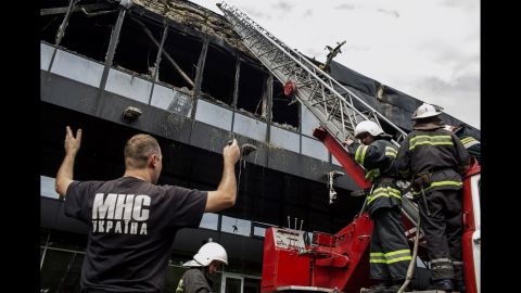 Firefighters work on extinguishing a fire at a local sports hall in Donetsk on May 27. 