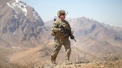 CSM Brian Hamm from Plano, Texas with the U.S. Army's 2nd Battalion 87th Infantry Regiment, 3rd Brigade Combat Team, 10th Mountain Division patrols up a mountainside near Forward Operating Base (FOB) Shank on March 31, 2014 near Pul-e Alam, Afghanistan.