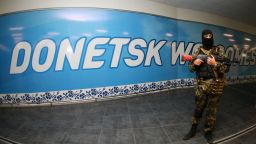 An armed pro-Russian militant takes position in the international airport of the eastern Ukrainian city of Donetsk on May 26, 2014.