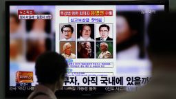 A TV news program shows a reward poster of Yoo Byung Eun with a $500,000 reward for  tips about his whereabouts.