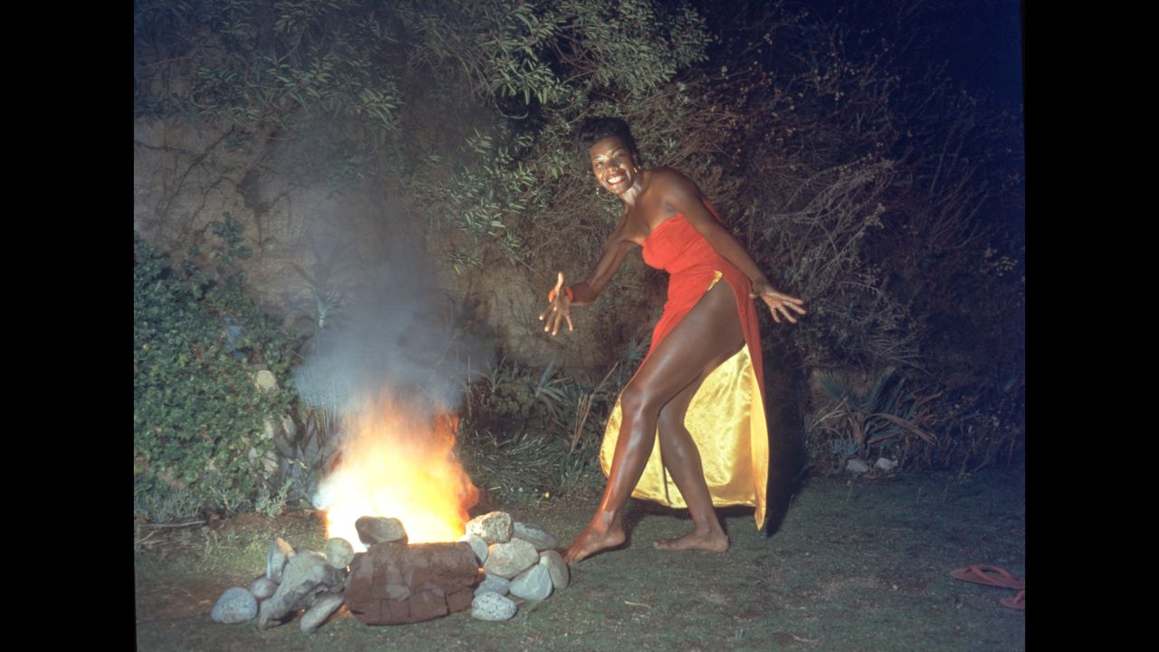 Angelou was also a professor, singer and dancer whose work spanned several generations. Here, she dances next to a fire in this promotional portrait taken for the cover of her first album, "Miss Calypso," in 1957.