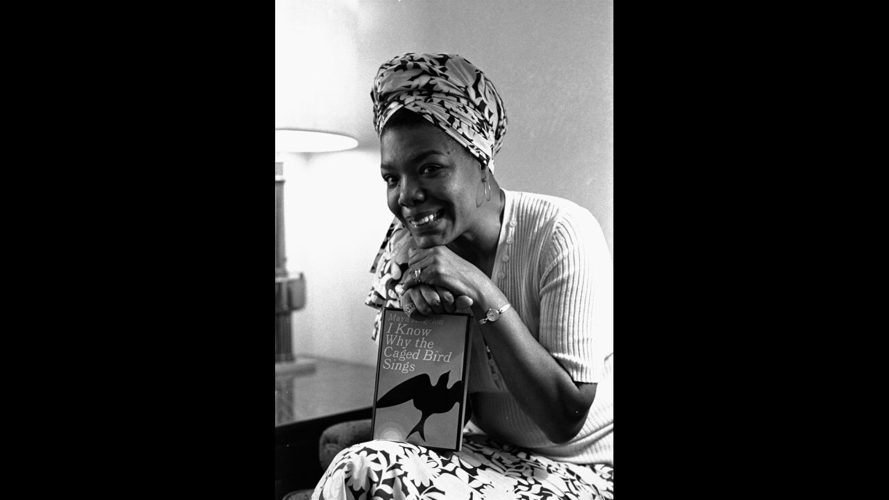 Angelou poses with her book "I Know Why the Caged Bird Sings" in 1971. It was the first in a series of autobiographical books.