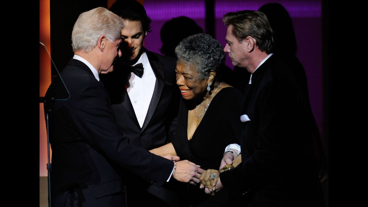 Clinton speaks to Angelou on stage at the the 2009 Women of the Year event hosted by Glamour magazine.