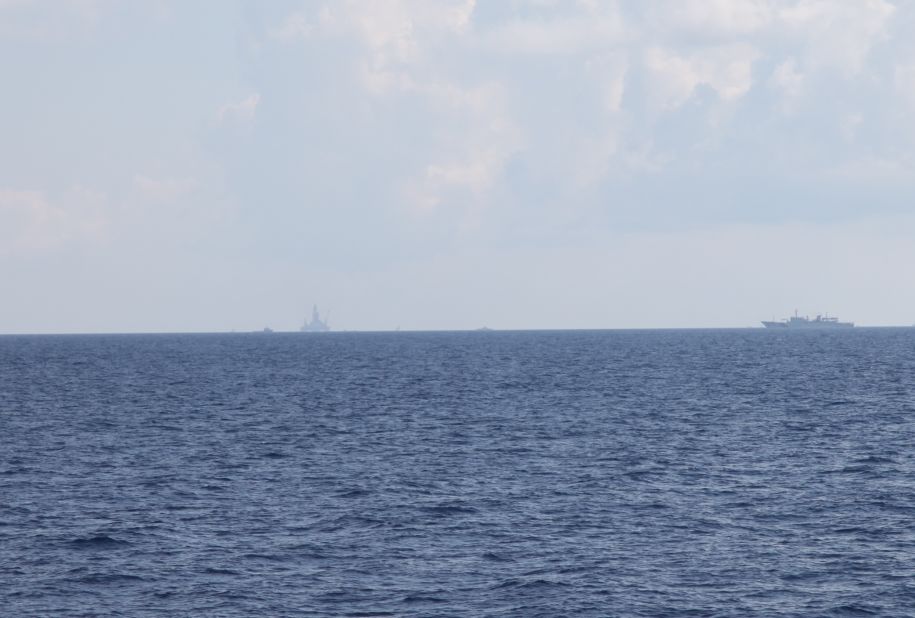 A Chinese Coast Guard ship screens a controversial oil platform drilling off the disputed Paracel Islands on May 28.