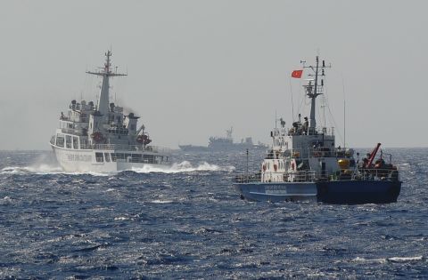 A Chinese Coast Guard vessel (left) appears to block a Vietnamese ship (right) near the area of China's oil drilling rig in disputed waters in the South China Sea on May 14. 