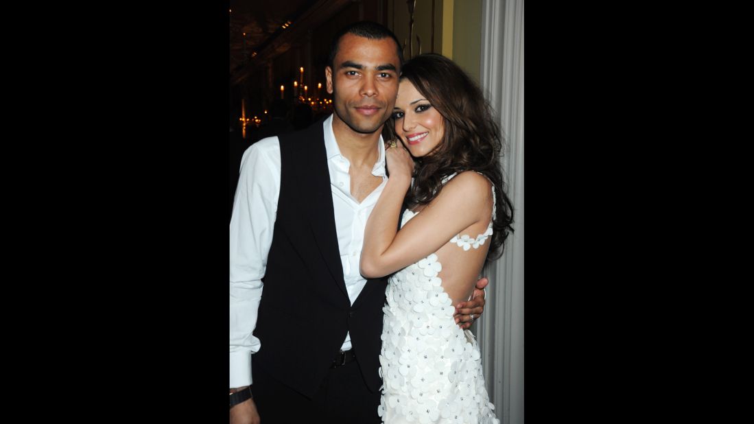 British "X-Factor" judge Cheryl Fernandez-Versini made headlines as then-girlfriend (and later wife) of England player Ashley Cole during the 2006 World Cup. "These WAGs were out buying beautiful clothes, they all looked stunning, they're by hotel pools drinking cocktails, running up enormous bar bills," said Kervin. "I think part of everybody who watched it thought 'how marvelous.'" 