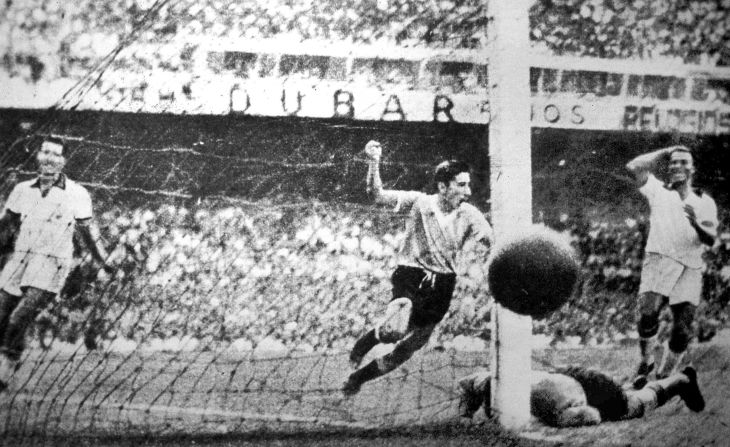 Uruguay's Alcides Ghiggia, center, scores the decisive goal in a 2-1 victory over Brazil at Rio de Janeiro's Maracana Stadium on July 16, 1950. With the result, Uruguay clinched its second World Cup title and spoiled the hopes of the host country. As Brazil prepares to host the World Cup for a second time this summer, here's a look back at what happened the first time around.
