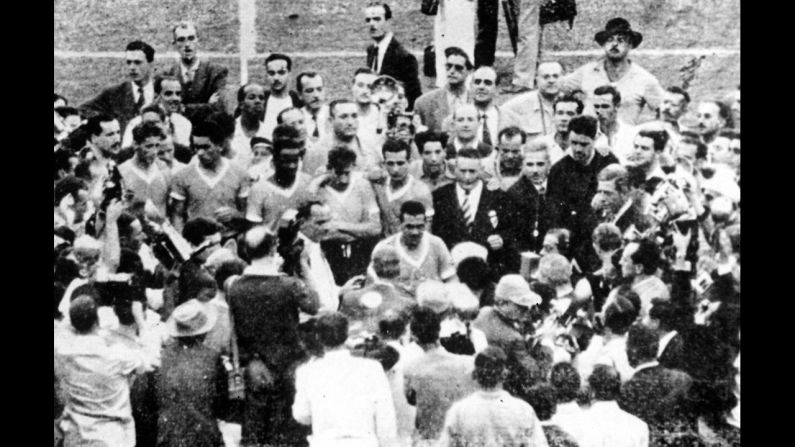 FIFA President Jules Rimet presents the trophy to Varela, Uruguay's captain. Uruguay also won the first World Cup, which it hosted in 1930, and it remains by far the smallest country to have won the tournament.