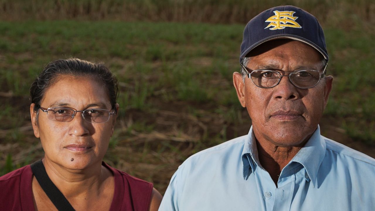 Juan Salgado, 65, poses with his lifelong partner Eugenia in the sugar cane fields of Chichigalpa, Nicaragua. 