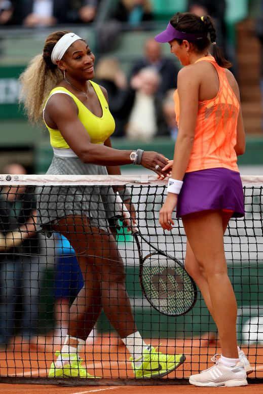 Williams congratulates her conqueror Garbine Muguruza, the Spaniard later explaining what the defending champion had told her: "She said that if I continue playing like this, I can win the tournament. I said, 'I will try, I will try.'"