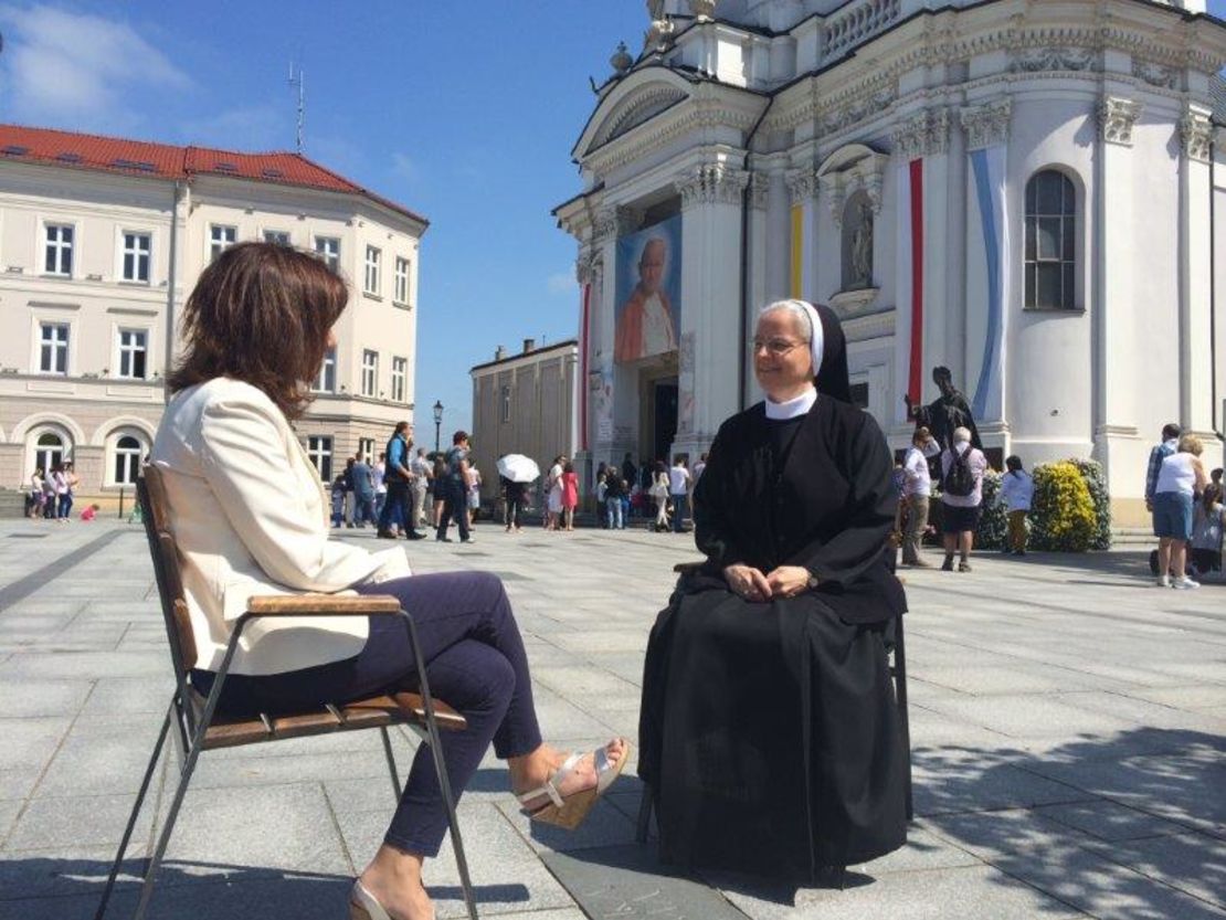 Paula Newton and Sister Benedykta Mazur sit outside Wadowice Basilica