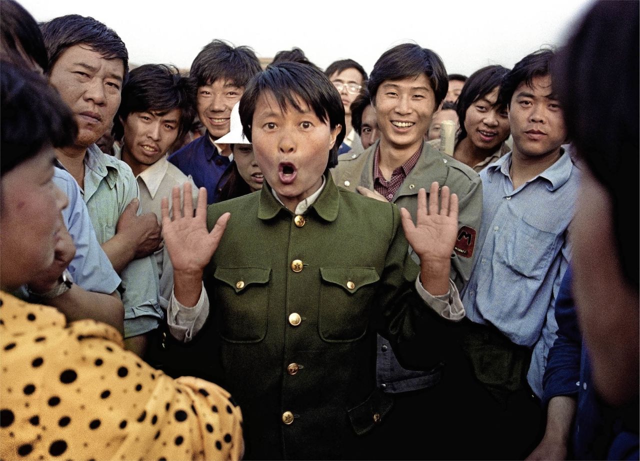 A soldier sings among pro-democracy protesters. Police and military would occasionally mix with protesters in an attempt to keep the demonstrations peaceful.