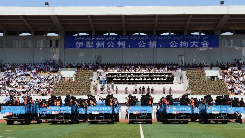 Dozens of terror suspects are found guilty before 7000 spectators at a stadium in China's Xinjiang Province.
