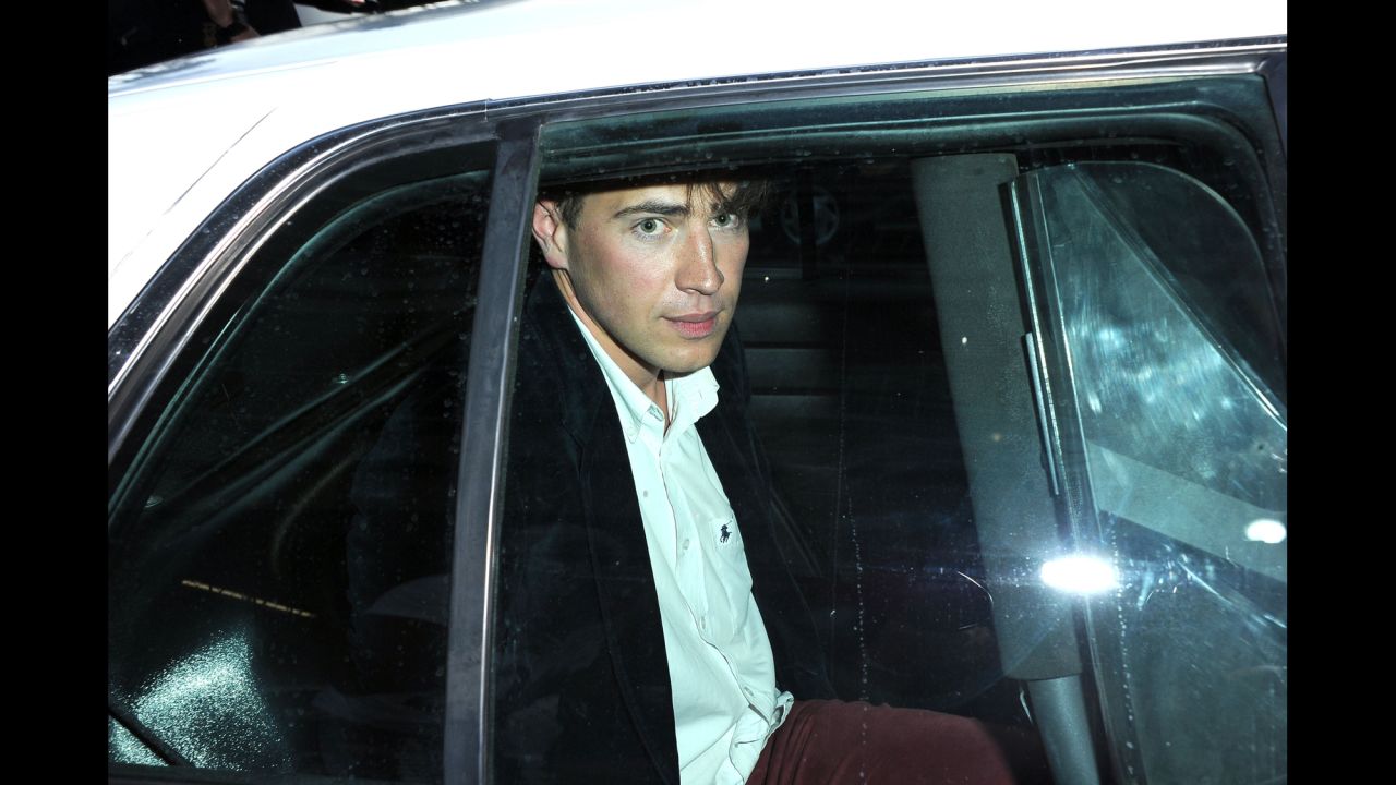 Vitalii Sediuk sits in the back of a police car after allegedly striking Brad Pitt in the face as Pitt and Angelina Jolie walked the red carpet at the premiere of Disney's "Maleficent" in Hollywood, California, on Wednesday, May 28. Sediuk has a history of confronting celebrities at red carpet events. 