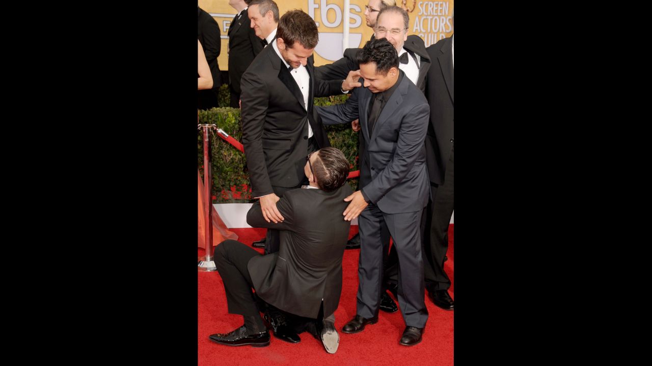 Sediuk hugs Bradley Cooper's legs as Michael Pena looks on at the 2014 Screen Actors Guild Awards in Los Angeles on January 18.