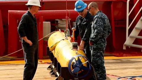 Technicians work on an autonomous underwater vehicle in 2014.