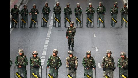 Thai soldiers guard a bus stop area to prevent an anti-coup demonstration in Bangkok on Thursday, May 29. 