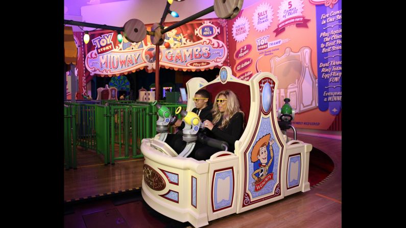 Daytime TV talk show host Wendy Williams and her son Kevin ride Toy Story Midway Mania! at Disney's Hollywood Studios theme park at Florida's Walt Disney World Resort.