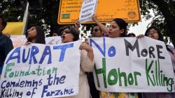 Pakistani human rights activists hold placards as they chant slogans during a protest in Islamabad on May 29, 2014 against the killing of pregnant woman Farzana Parveen was beaten to death with bricks by members of her own family for marrying a man of her own choice in Lahore. Pakistan's prime minister demanded "immediate action" over the brutal murder of a pregnant woman who was bludgeoned to death with bricks outside a courthouse while police stood by. Farzana Parveen was attacked on May 27 outside the High Court building in the eastern city of Lahore by more than two dozen brick-wielding attackers, including her brother and father, for marrying against the wishes of her family. AFP PHOTO/Aamir QURESHIAAMIR QURESHI/AFP/Getty Images
