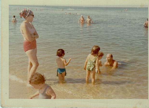 This family photo from a 1965 trip to Long Island, New York, has special meaning for <a href="index.php?page=&url=http%3A%2F%2Fireport.cnn.com%2Fdocs%2FDOC-728247">Beth Alice Barret</a> all these years later. She's not pictured, but her dad is seen here playing with her then-2-year-old brother. "These special moments mean so much to my family because a few years later, our father died suddenly," she said. This photo kept that moment alive for her.