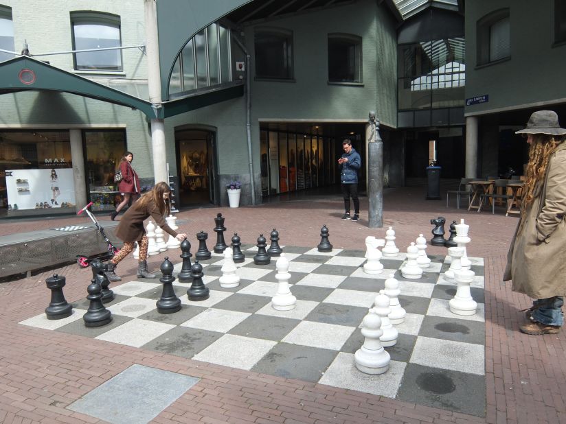 The Chess Museum is located inside a former prison. Outside, punishments are still doled out on the giant game board overlooked by a bust of Max Euwe.