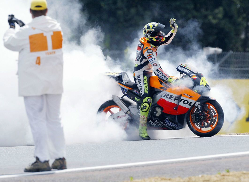 Ever the showman. Rossi produces a sea of burning tire smoke as he celebrates yet another MotoGP victory. 