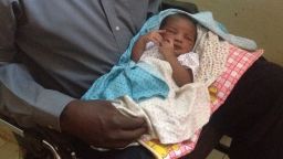 A sudanese woman sentenced to die for refusing to renounce her Christianity has given birth to a girl in prison. Photo is of the husband holding the baby girl on May 28. Baby girl was born on Monday May 26. Photo taken by CNN Stringer and is CNN property.