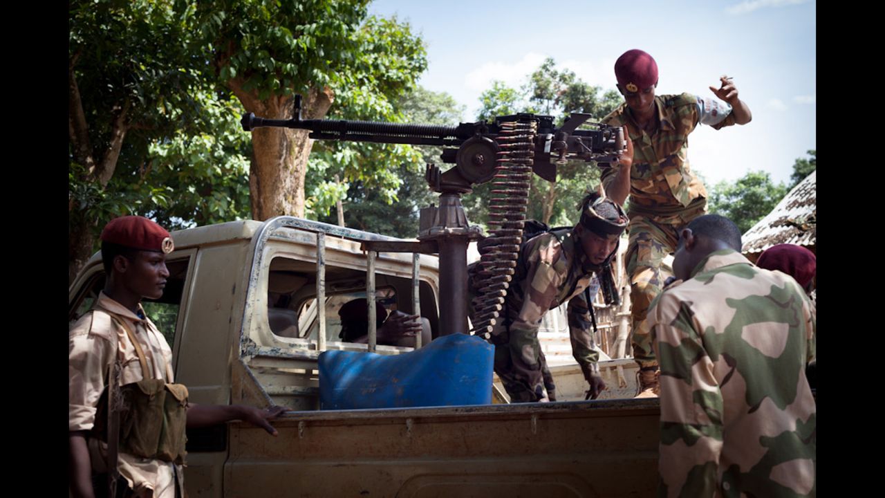 Members of the Republican Forces climb into a pickup truck to patrol the area. This group was involved in clashes with anti-balaka militia outside Bambari, and two were wounded.