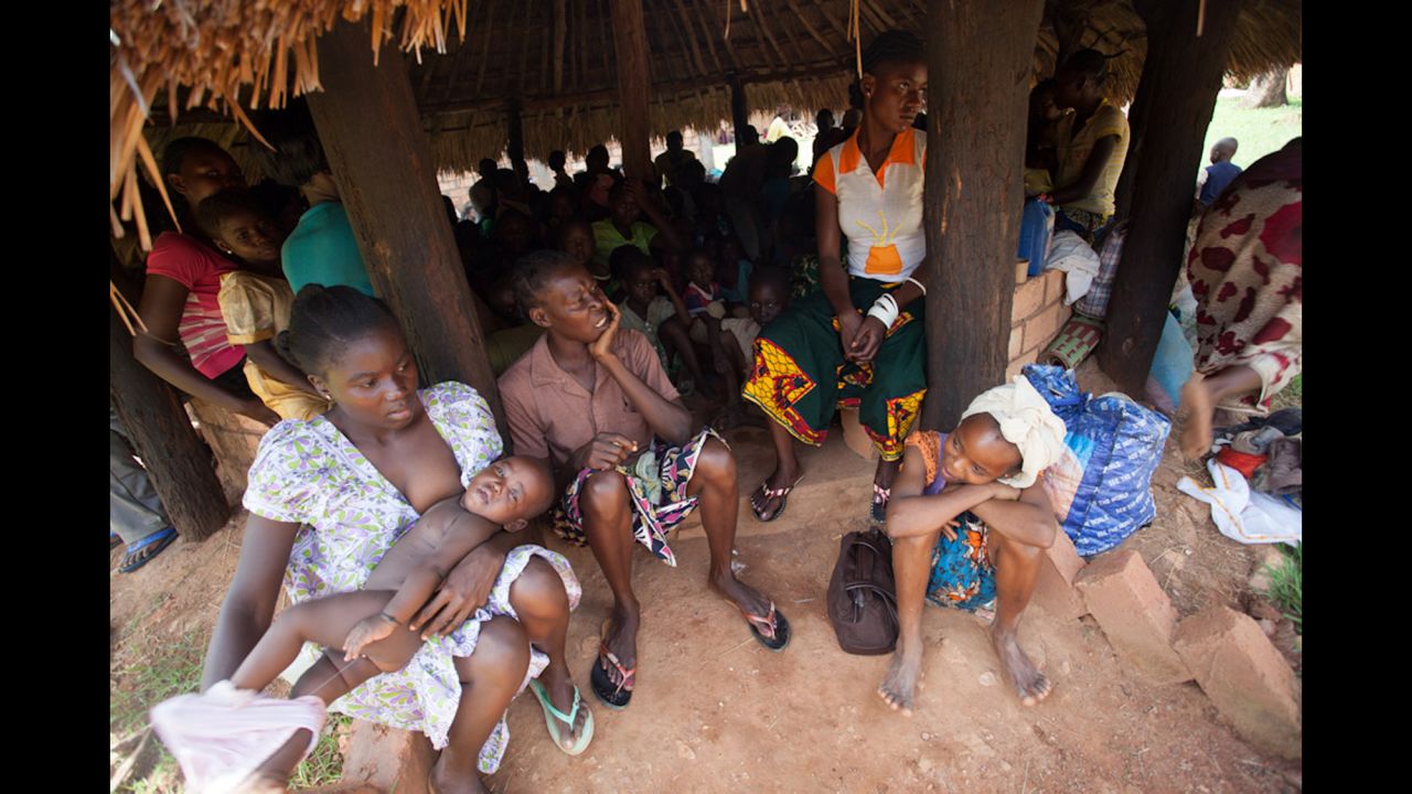 Anxious people take refuge on the day of the first clashes in Bambari. Non-Muslim youths, armed with clubs and machetes, patrol the compound where their families sleep at night.