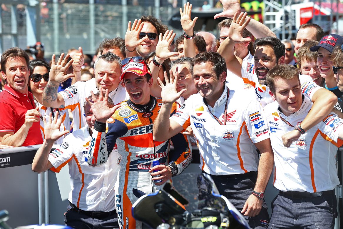 Marc Marquez celebrates his fifth consecutive MotoGP win at Le Mans with his team.