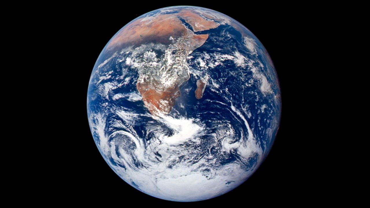 View of the Earth as seen by the Apollo 17 crew traveling toward the moon, known as "Blue Marble."