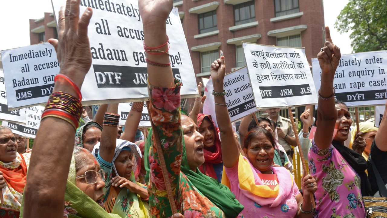 Activists from The All India Democratic Women's Association (AIDWA) and Indian Students Union shout slogans in front of Uttar Pradesh Bhawan in New Delhi on May 31, 2014, against the gang-rape and death of two teenage girls in Budaun district, India's northern state of Uttar Pradesh. Two girls aged 14 and 15 from the lowest Dalit caste have been found hanging from a tree in a northern Indian village after they were gang-raped by five men, police said in a brutal attack highlighting the country's poor record on sexual violence. AFP PHOTO/RAVEENDRAN (Photo credit should read RAVEENDRAN/AFP/Getty Images)