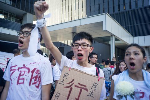 Protesters marched to Hong Kong's government headquarters to demand democracy in Hong Kong and China.