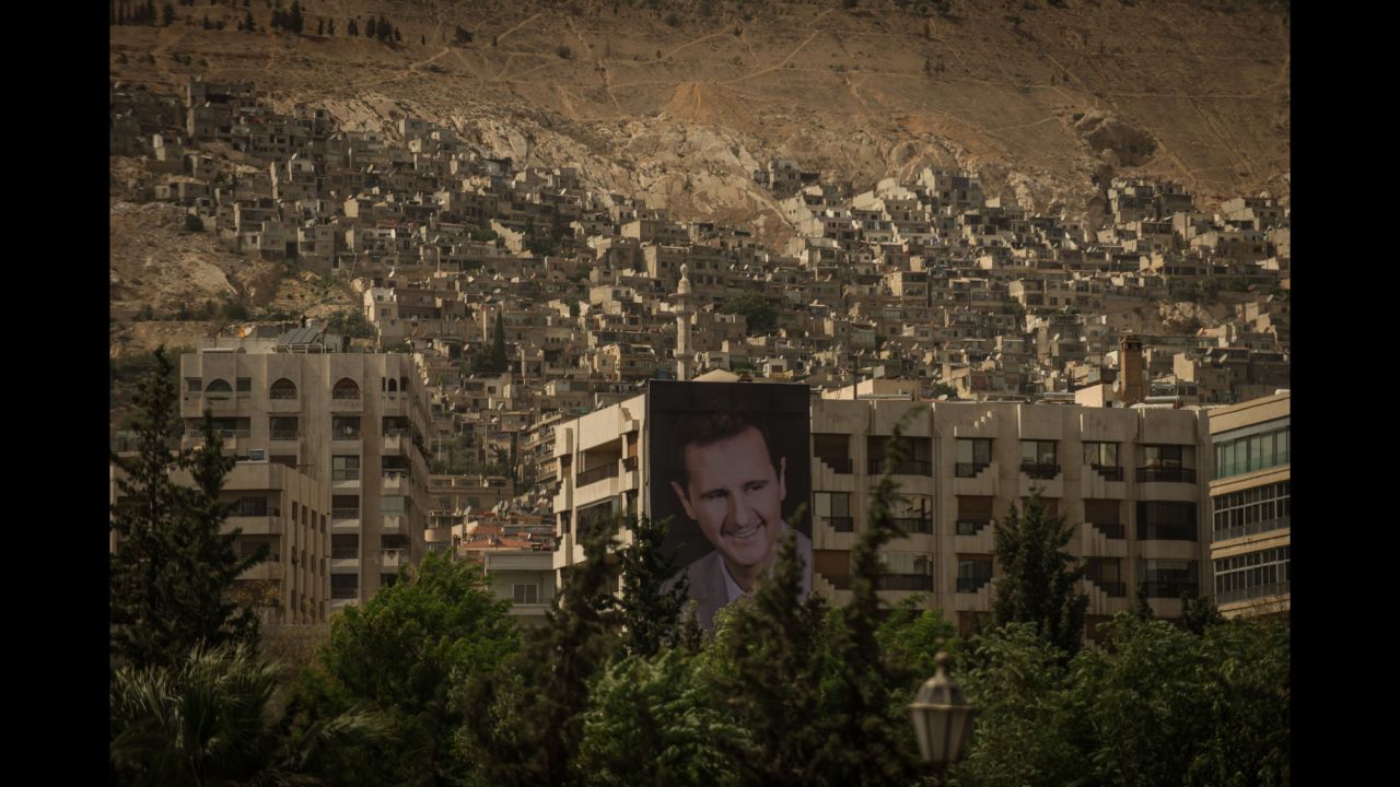 A giant poster of Syrian President Bashar al-Assad is seen in Damascus, Syria, on Saturday, May 31, as the capital prepares for presidential elections.