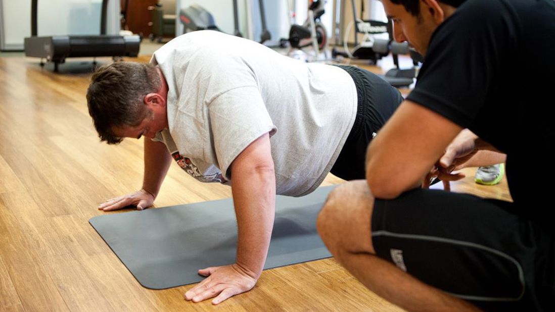 Mike Wilber works his arms and core in the plank position. "The midway trip turned into a personal journey for me," Wilber said. "It wasn't the physical challenge as much as a mental challenge. Something that I thought I couldn't do or wouldn't be able to do -- and now I have done it."